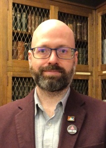 Image of Steve Duckworth in front of rare book collection